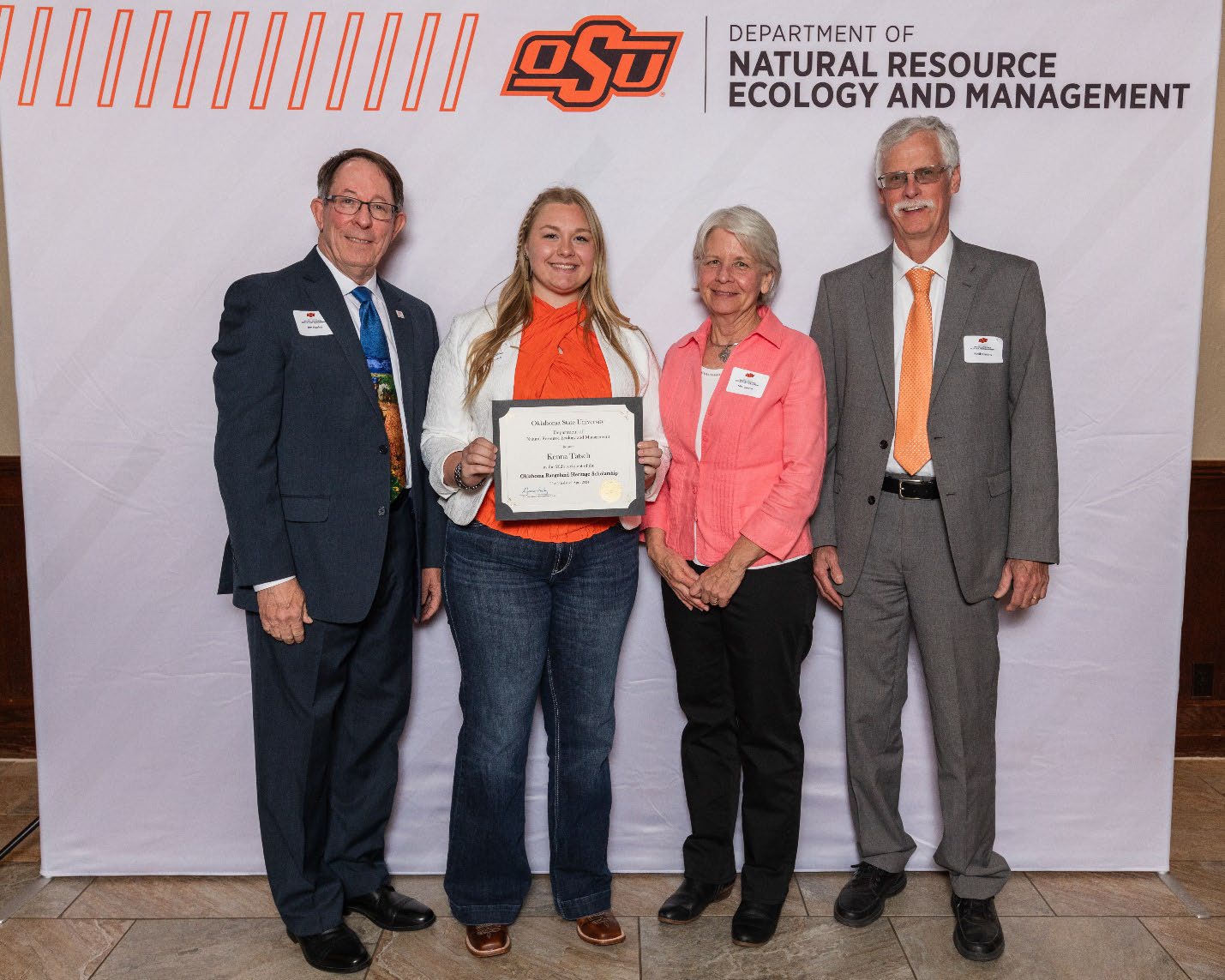 Kenna with Donors holding her award next to Dr. Keith Owens and Dr. Jim Ansley.