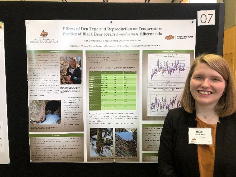 Ronie Loffelmacher standing in front of her poster presentation.