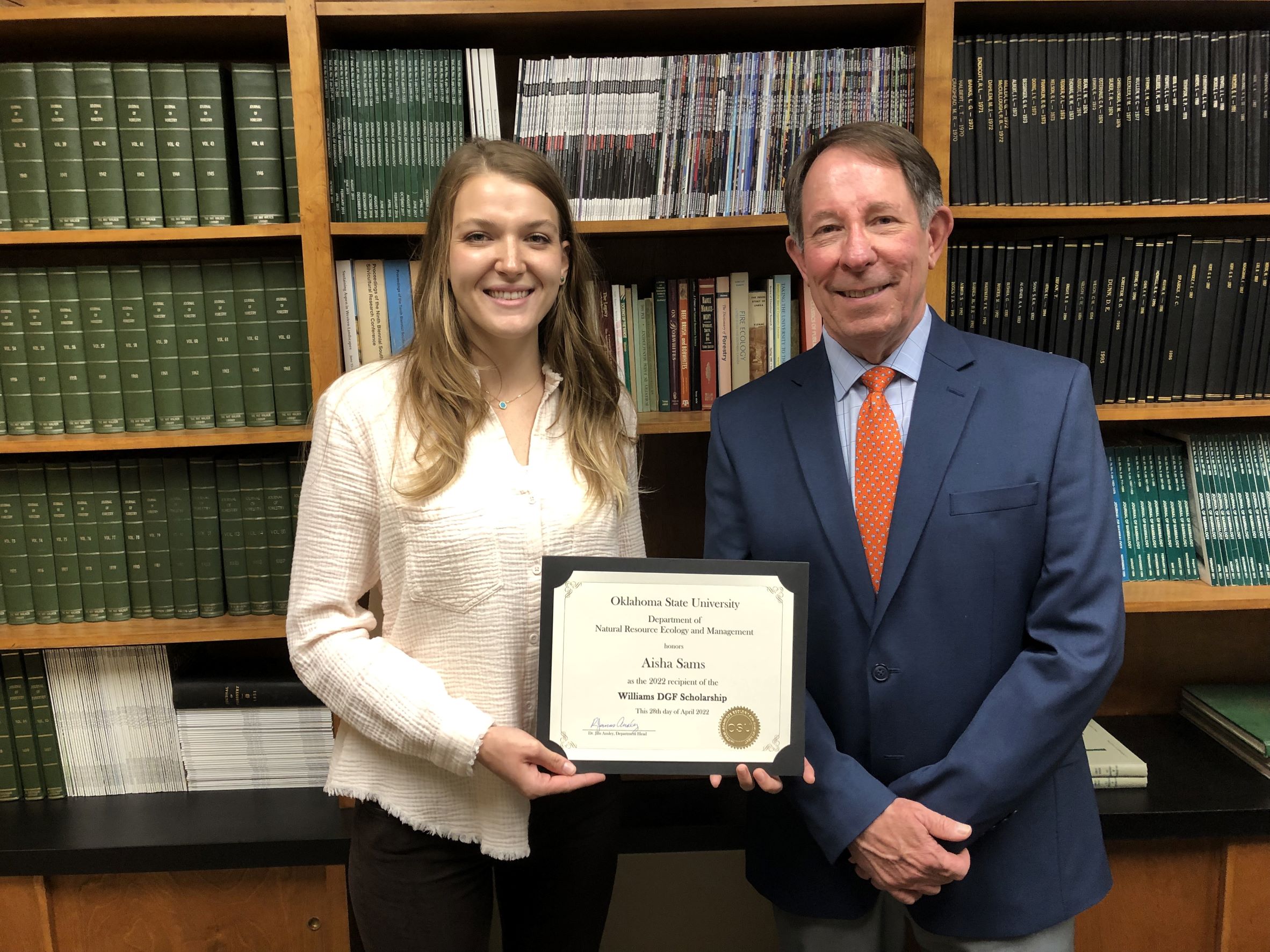 Aisha Samas receving a scholarship from Dr. Jim Ansley. Aisha Samas receving a scholarship from Dr. Jim Ansley.