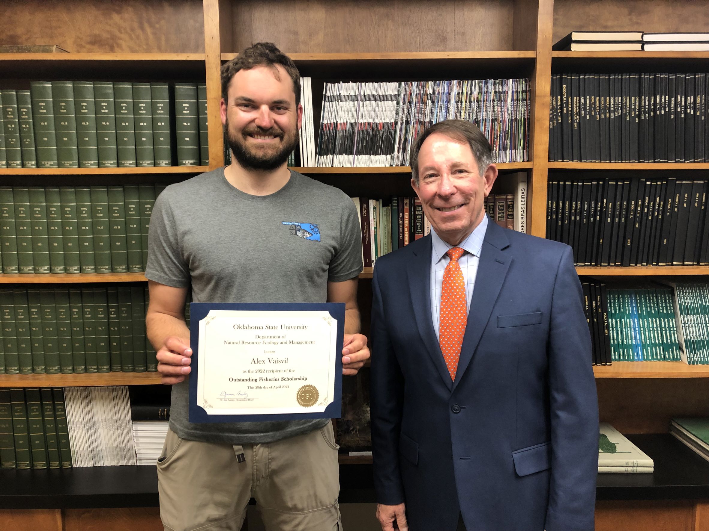 Alex Vaisvil receiving a scholarship from Dr. Jim Ansley. Alex Vaisvil receiving a scholarship from Dr. Jim Ansley.
