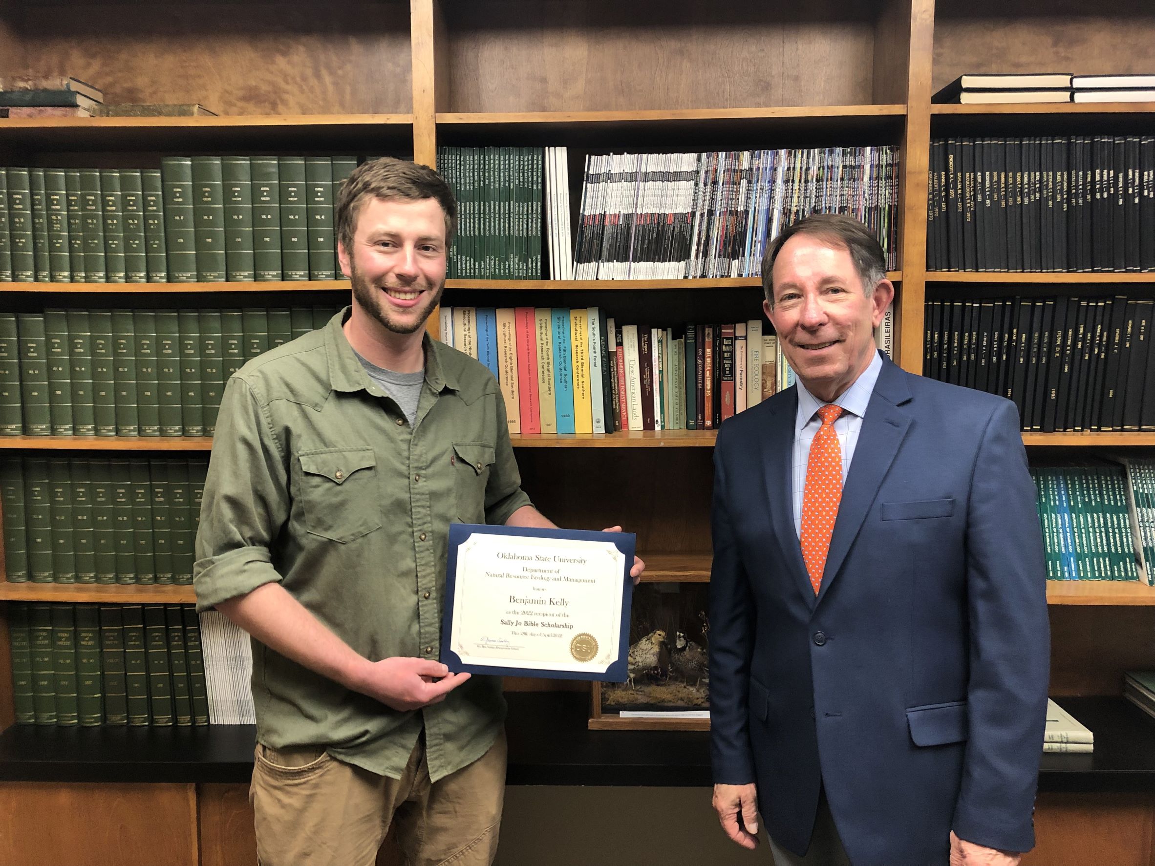 Benjamin Kelly receiving a scholarship from Dr. Jim Ansley. Benjamin Kelly receiving a scholarship from Dr. Jim Ansley.