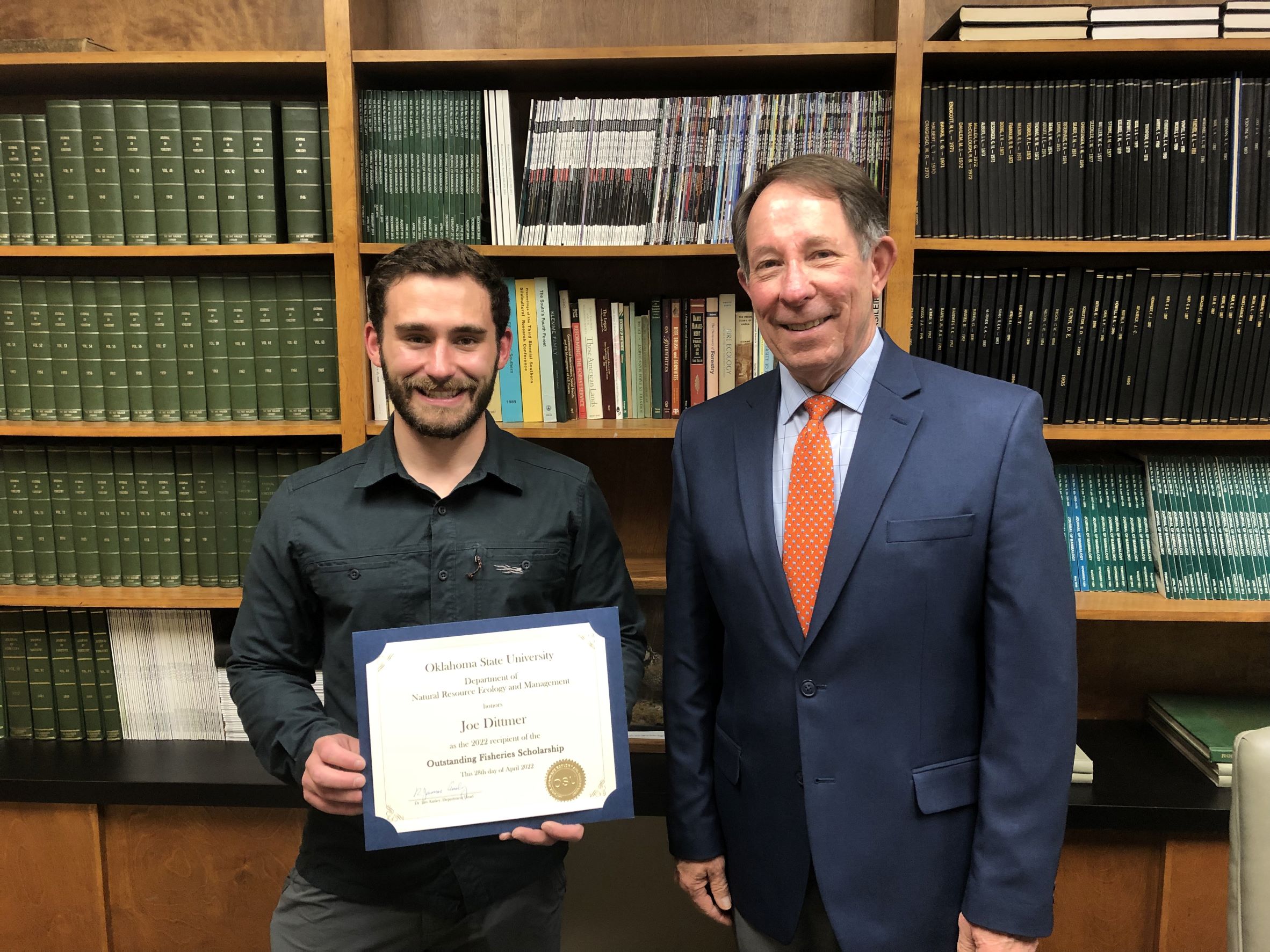 Joe Dittmer receiving a scholarship from Dr. Jim Ansley. Joe Dittmer receiving a scholarship from Dr. Jim Ansley.
