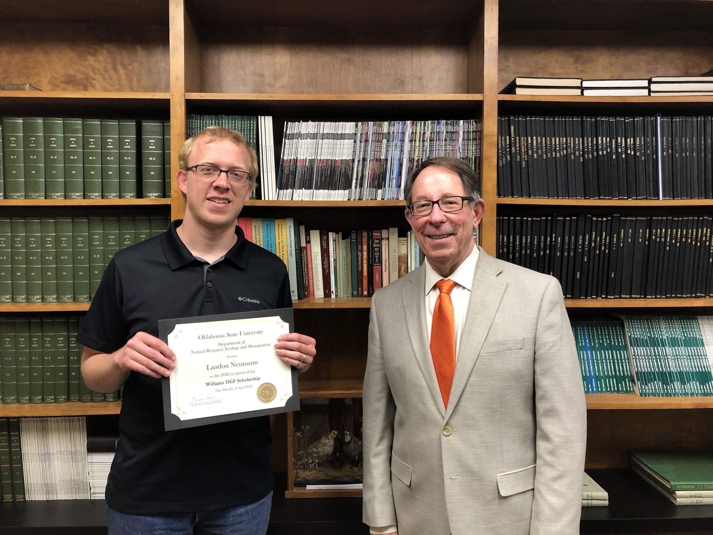 Landon Neumann receiving a scholarship from Dr. Jim Ansley. Landon Neumann receiving a scholarship from Dr. Jim Ansley.