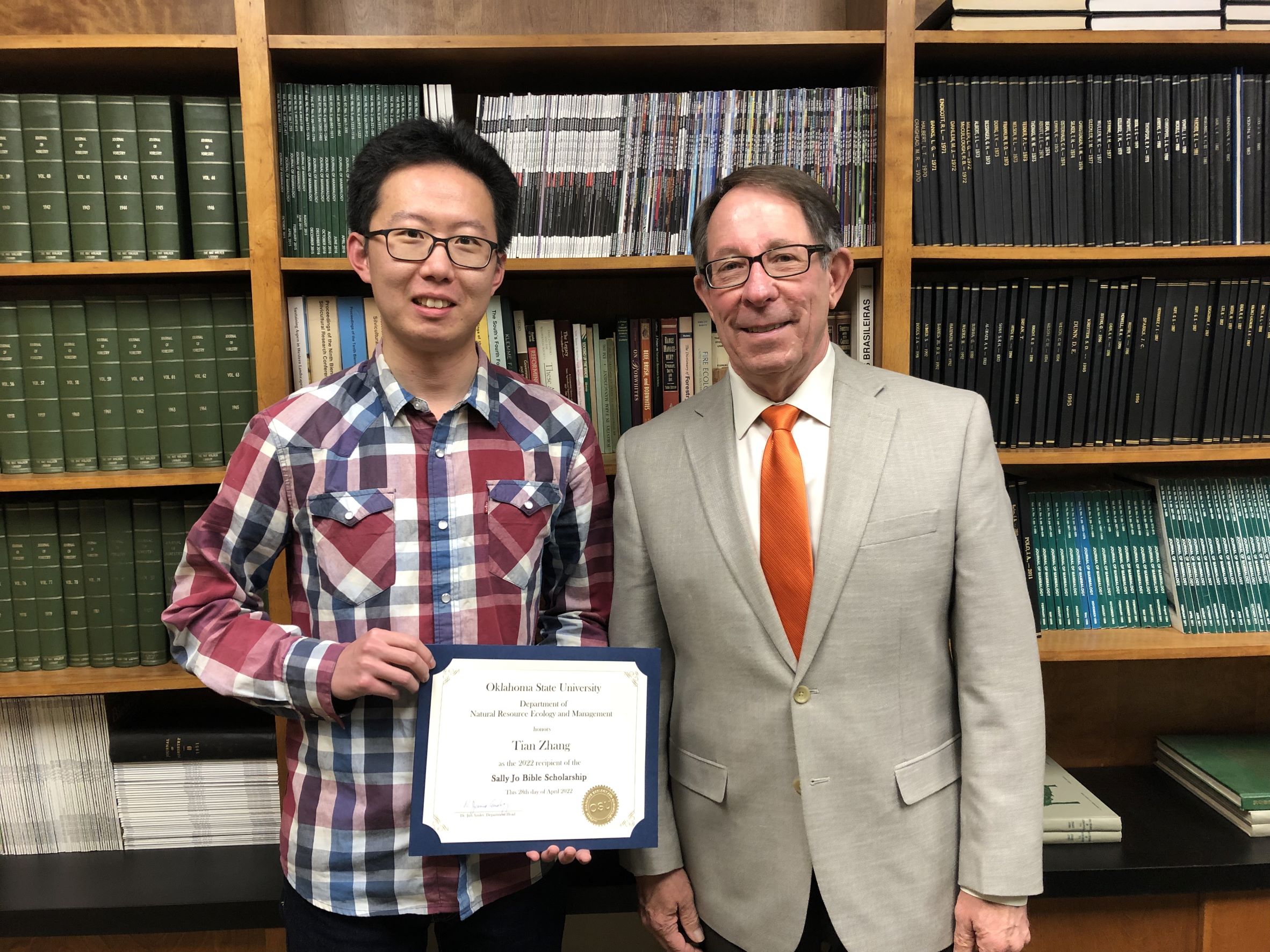 Tian Zhang receiving a scholarship from Dr. Jim Ansley. Tian Zhang receiving a scholarship from Dr. Jim Ansley.