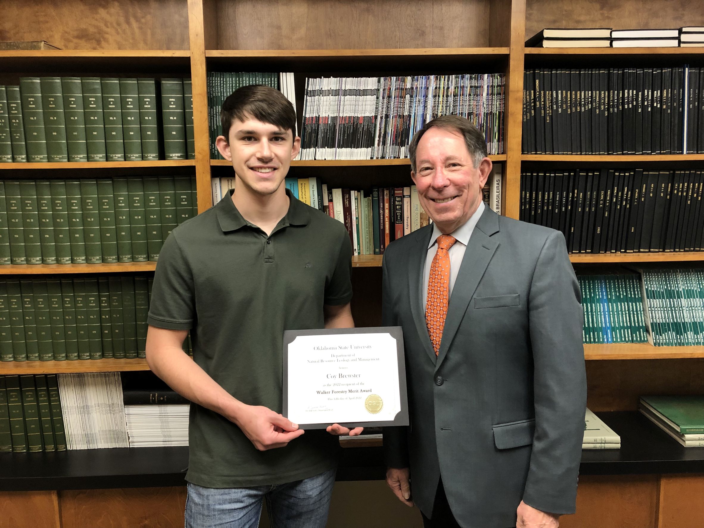 Coy Brewster receiving a scholarship from Dr. Jim Ansley. Coy Brewster receiving a scholarship from Dr. Jim Ansley.