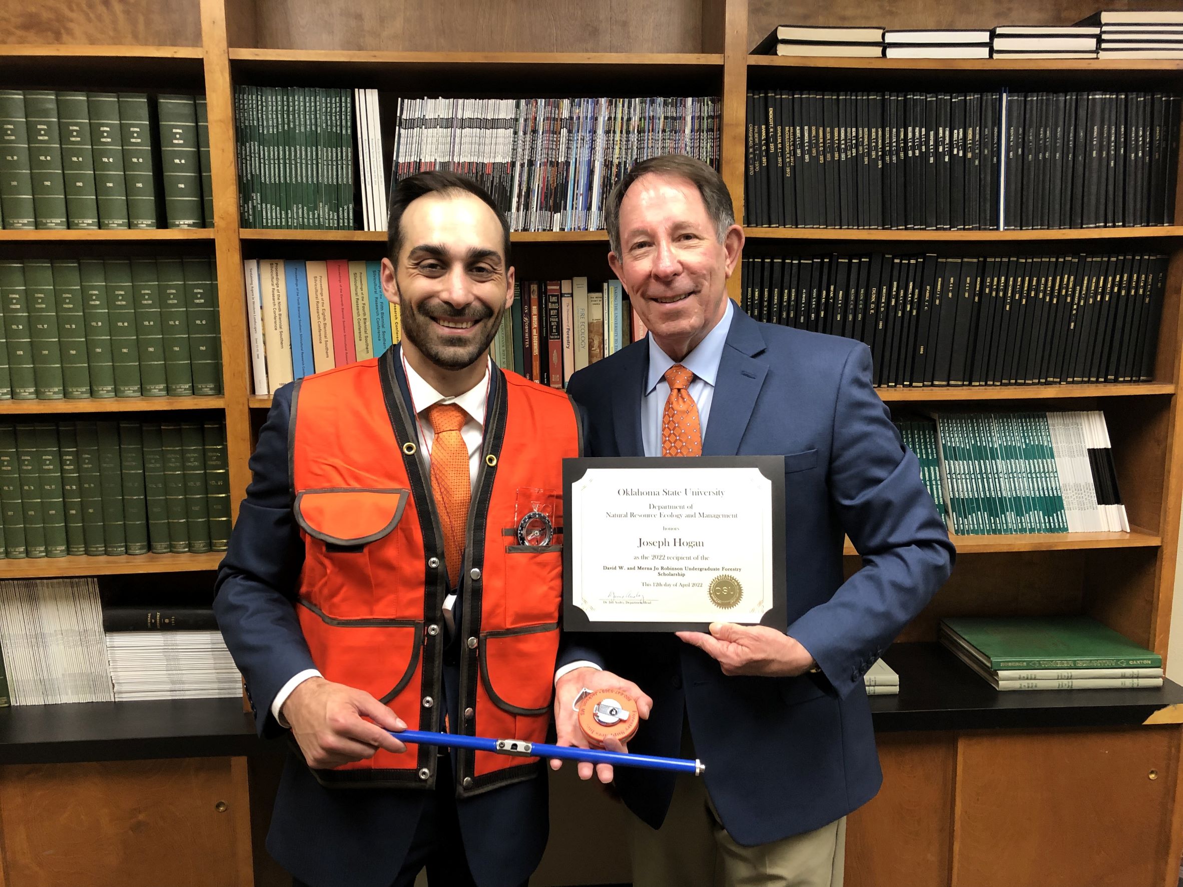 Joseph Hogan in forest measurement and timber cruising gear receiving a scholarship from Dr. Jim Ansley. Joseph Hogan in forest measurement and timber cruising gear receiving a scholarship from Dr. Jim Ansley.