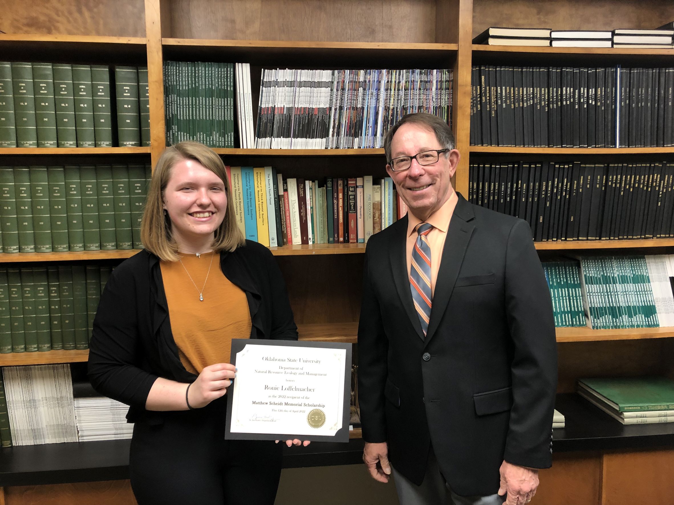 Ronie Loffelmacher receiving a scholarship from Dr. Jim Ansley. Ronie Loffelmacher receiving a scholarship from Dr. Jim Ansley.