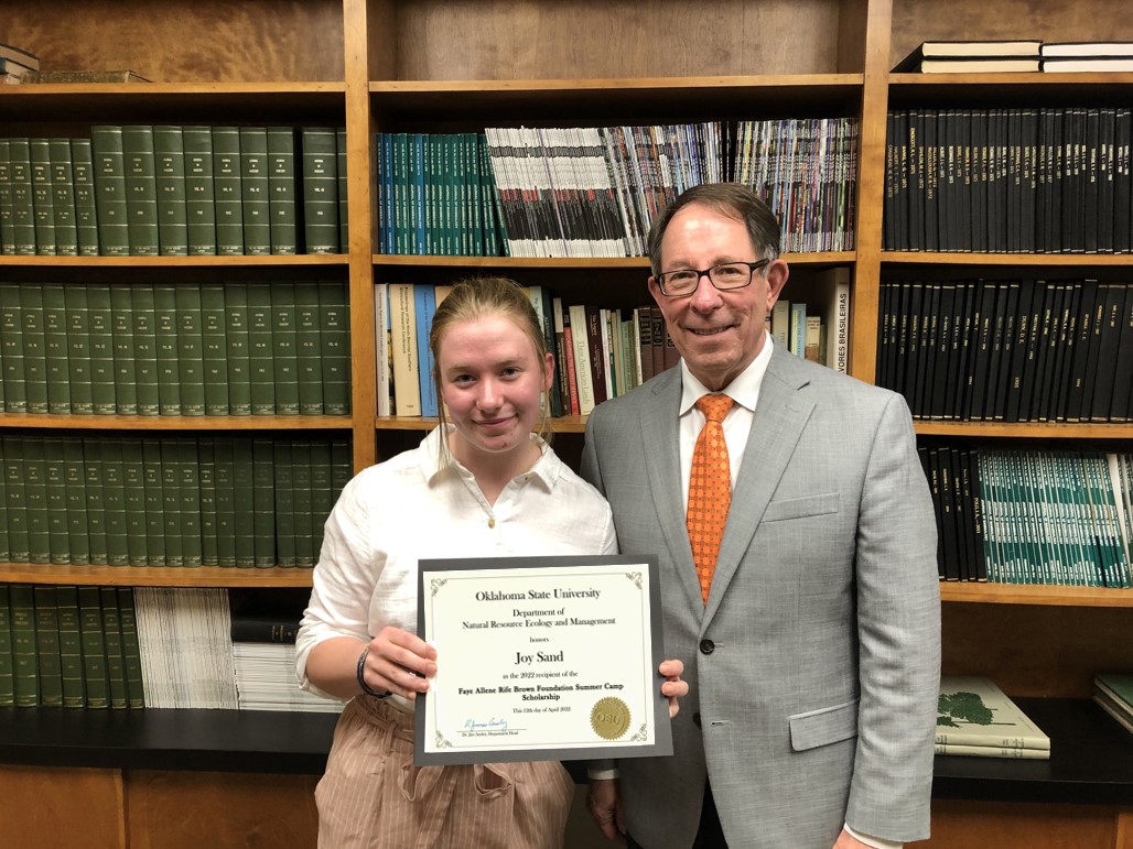 Joy Sand receiving a scholarship from Dr. Jim Ansley. Joy Sand receiving a scholarship from Dr. Jim Ansley.