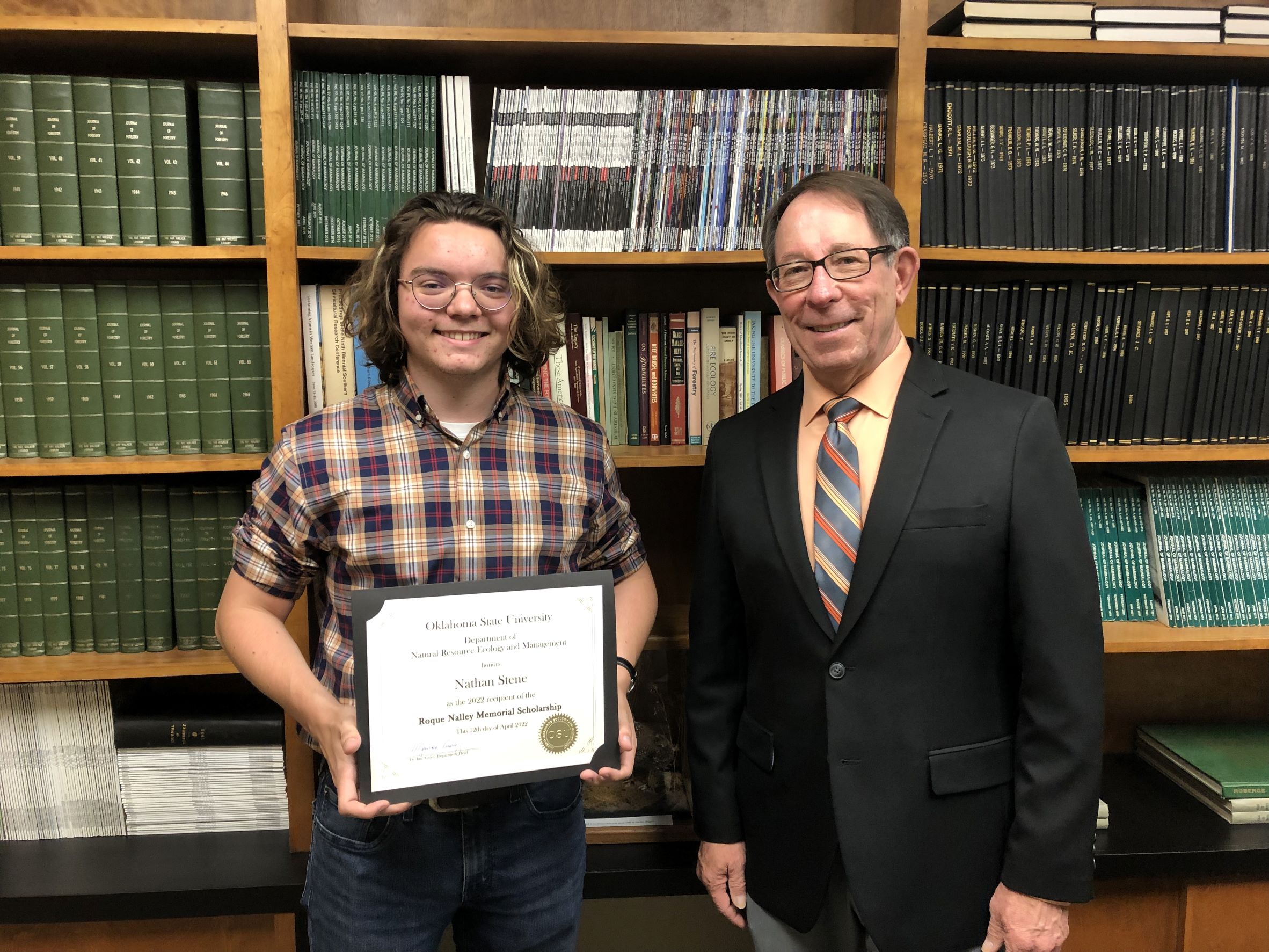 Nathan Stene receiving his scholarship from Dr. Jim Ansley. Nathan Stene receiving his scholarship from Dr. Jim Ansley.