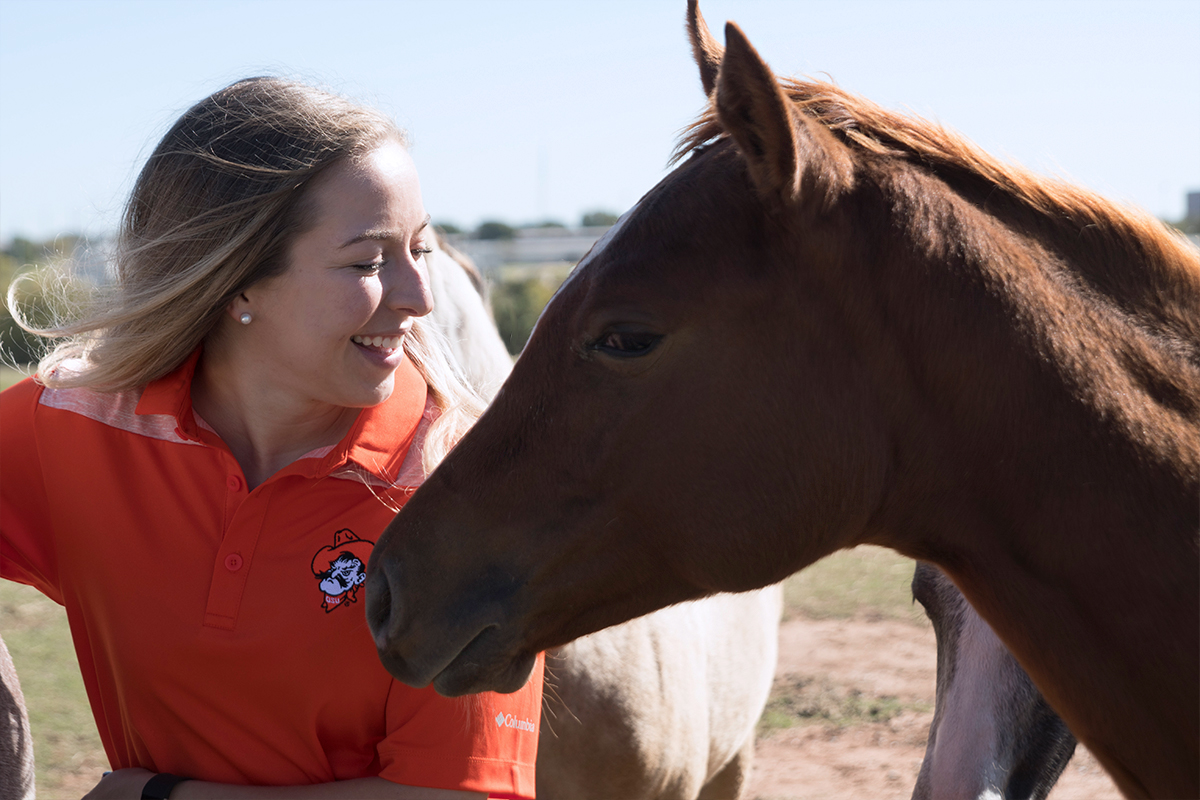 equine-cert.jpg Student with horse