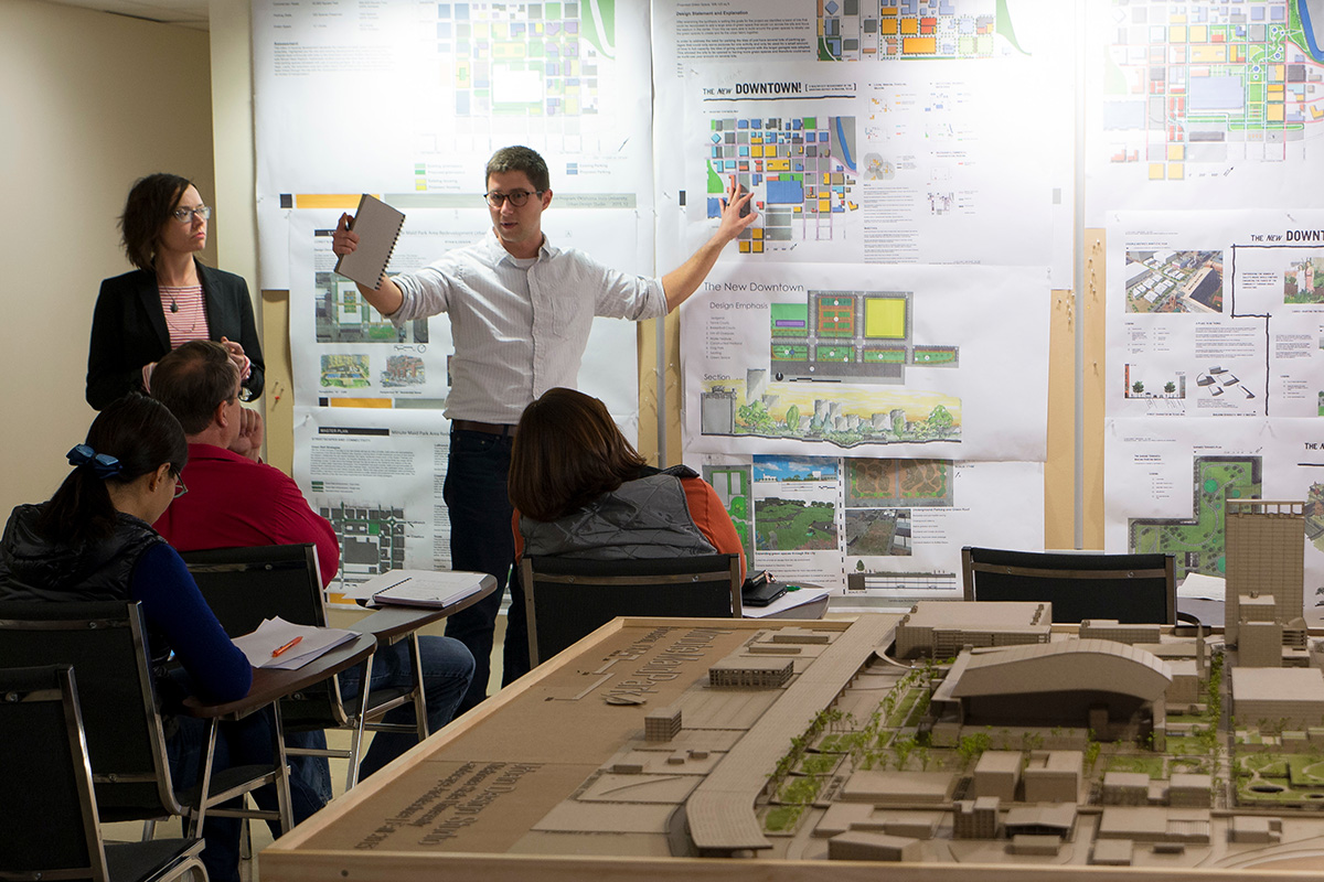 student presenting project Student presenting landscape architecture project to a panel jury.