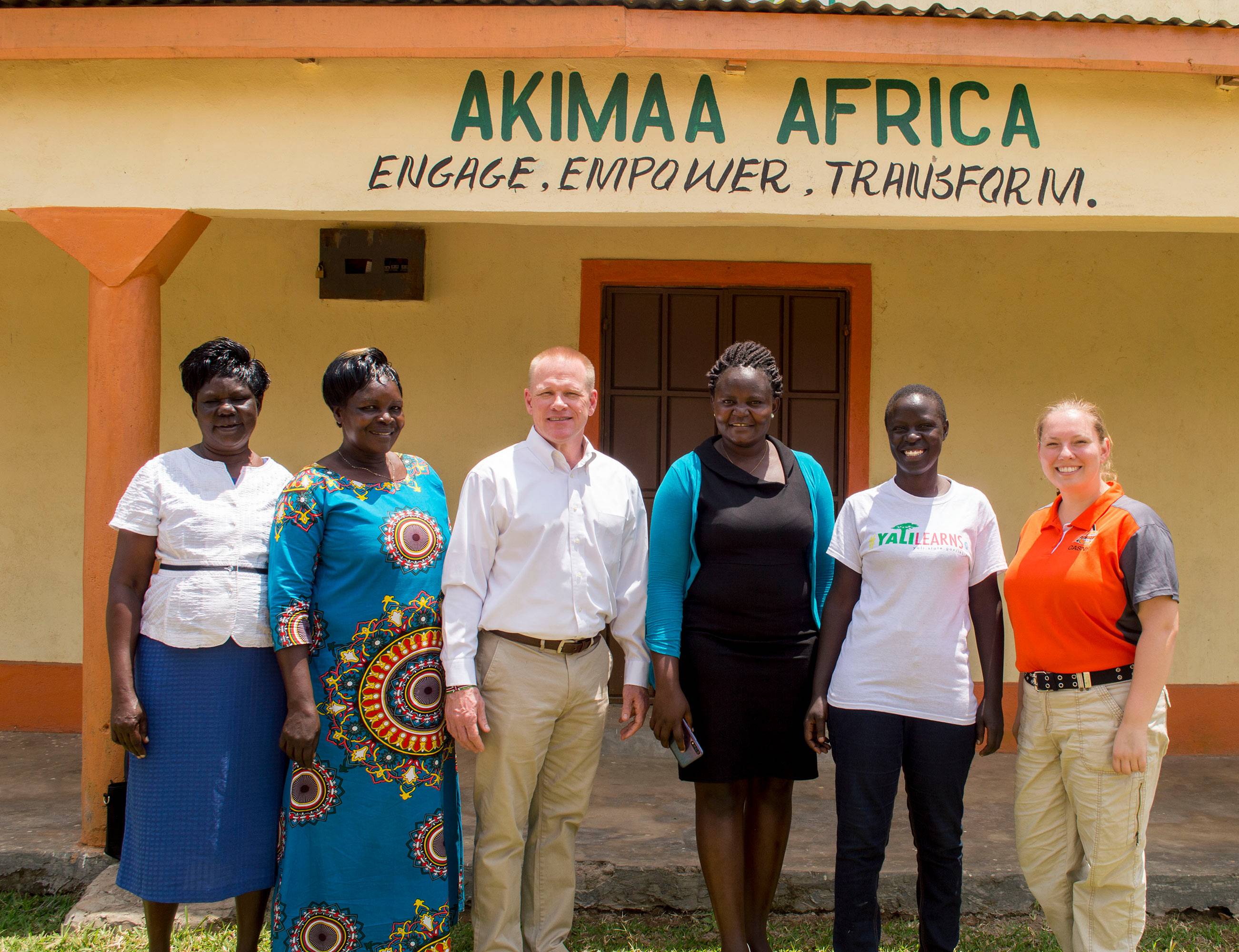 Six people standing in front of the Akimaa Africa building.