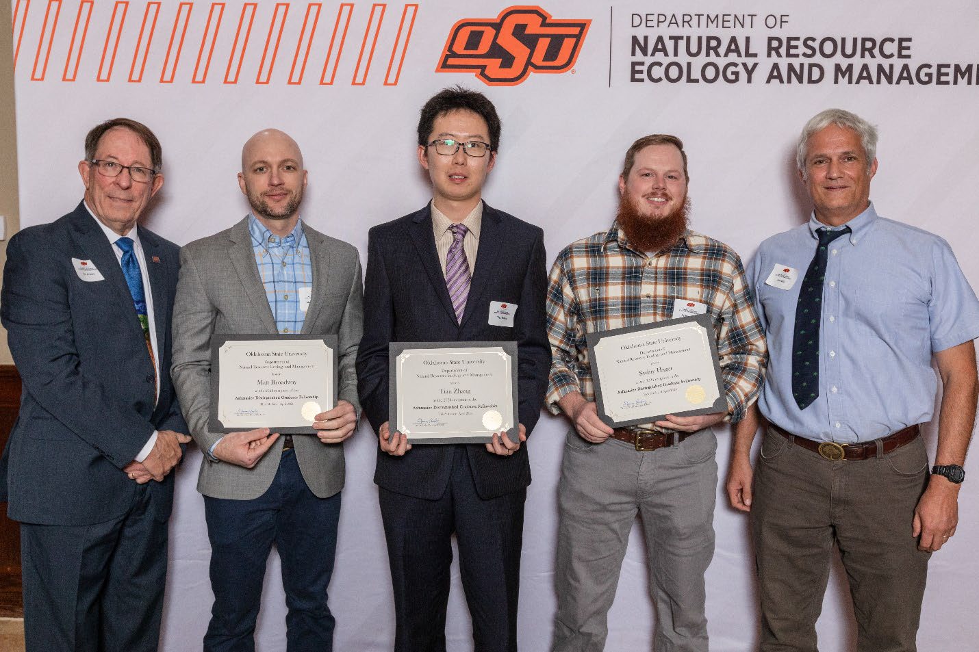 Matt, Tian, Sydny are holding their award next to Dr. Rod Will. Matt, Tian, Sydny are holding their award next to Dr. Rod Will.