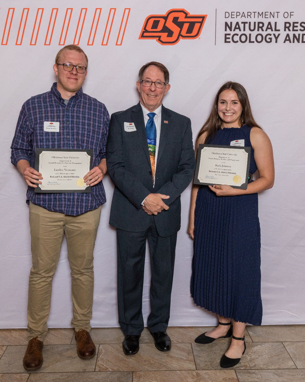 Landon and Kayla holding their award next to Dr. Jim Ansley. Landon and Kayla holding their award next to Dr. Jim Ansley.