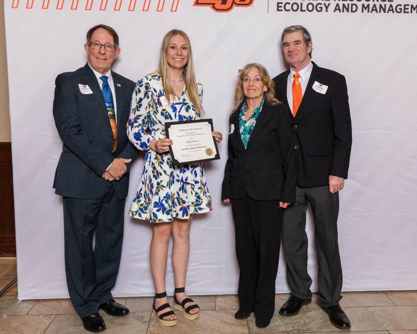 Molly with Jesse’s parents and Dr. Jim Ansley. Molly with Jesse’s parents and Dr. Jim Ansley.