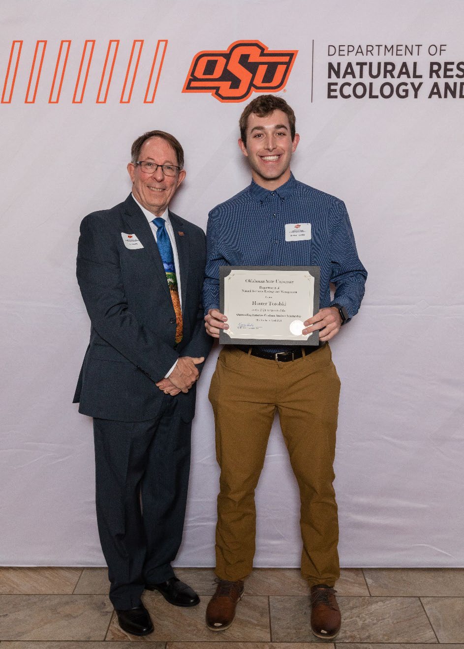 Hunter Torolski holding his award next to Dr. Jim Ansley. Hunter Torolski holding his award next to Dr. Jim Ansley.