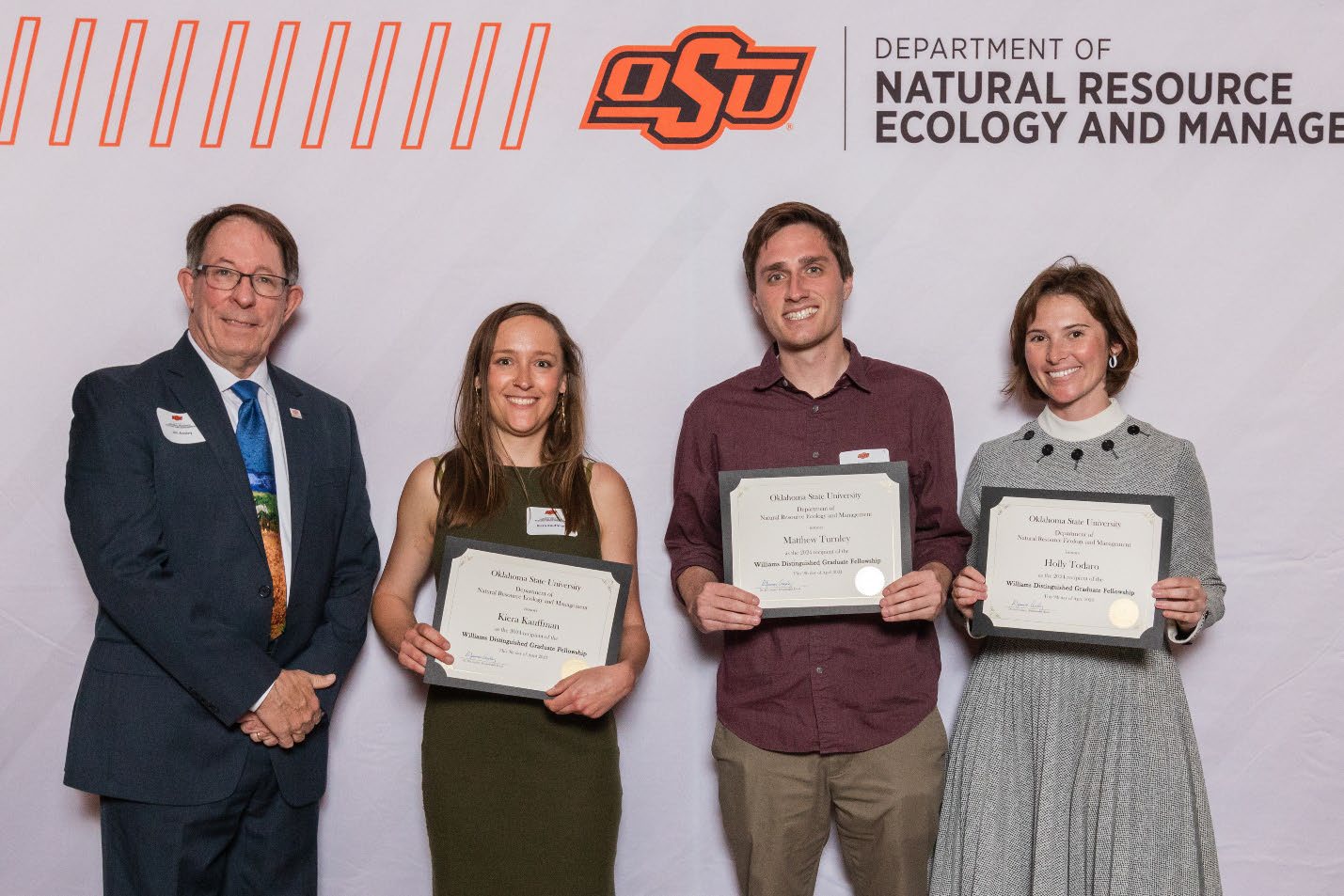 Dr. Jim Ansley, Kiera, Matthew and Holly holding their awards. Dr. Jim Ansley, Kiera, Matthew and Holly holding their awards.