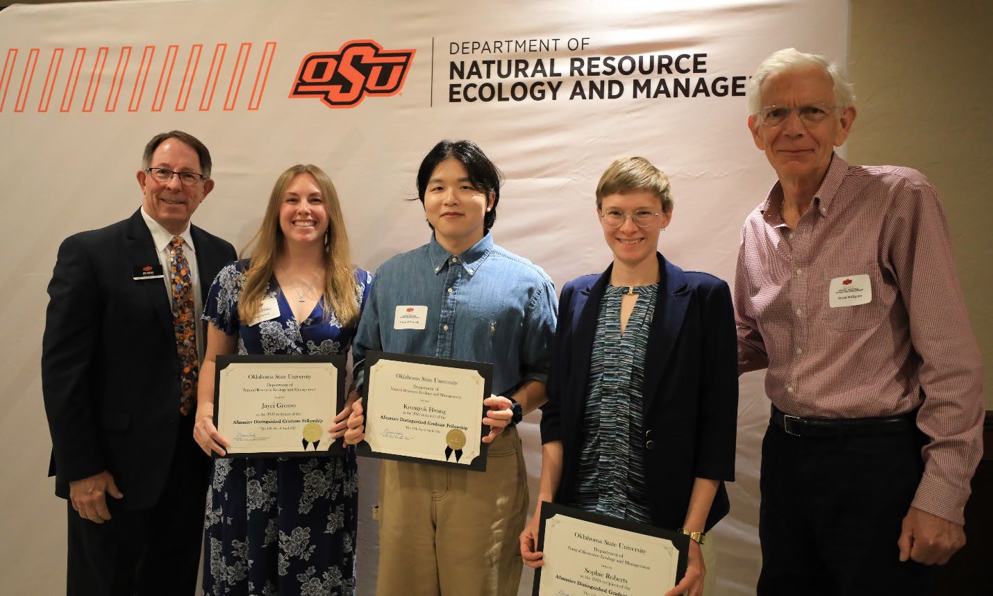 Dr. Jim Ansley with three scholarship awardees holding their plaque and Dr. Steve Hallgren. Dr. Jim Ansley with three scholarship awardees holding their plaque and Dr. Steve Hallgren.