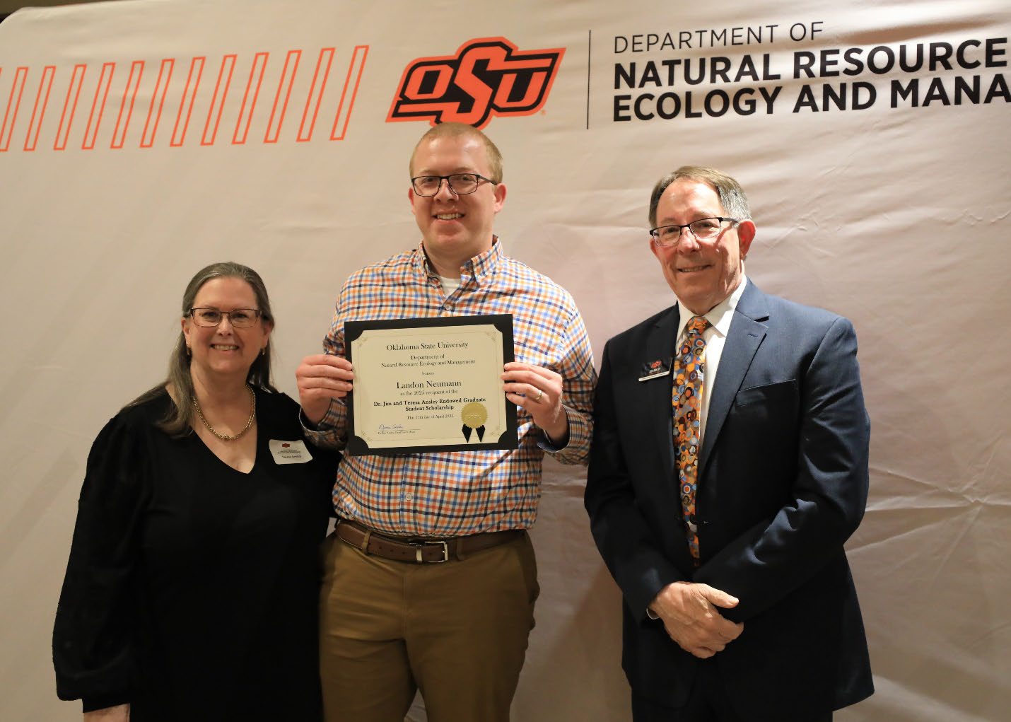 Landon Neumann holding his award next to Dr. Jim and Teresa Ansley. Landon Neumann holding his award next to Dr. Jim and Teresa Ansley.