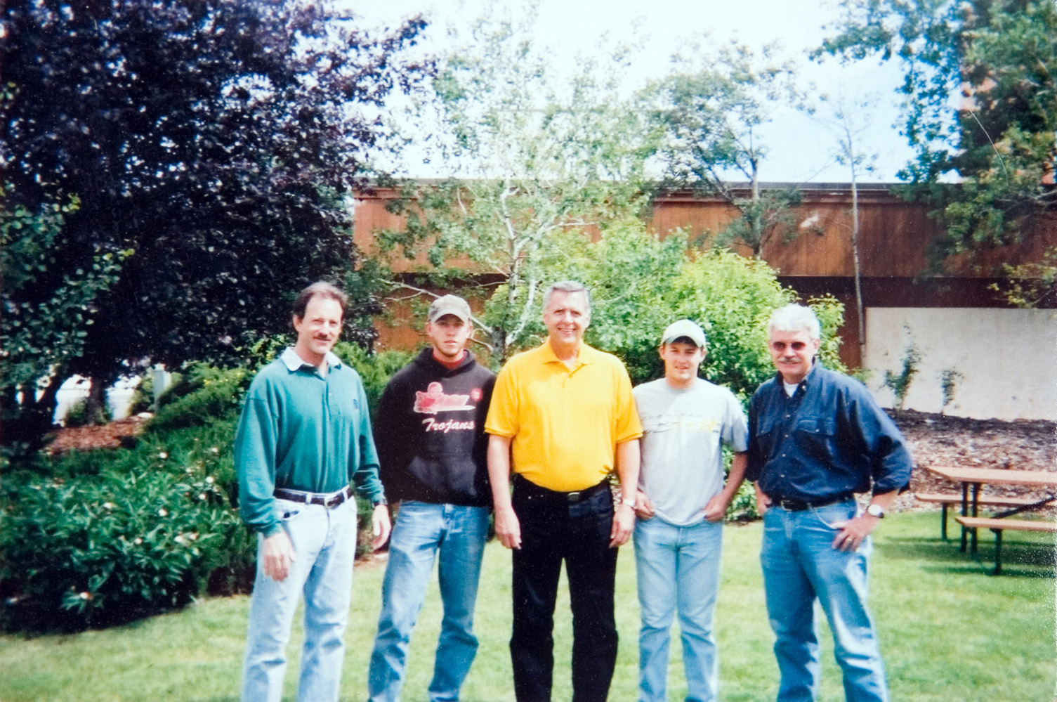 Instructors and students posing for a photo outside.