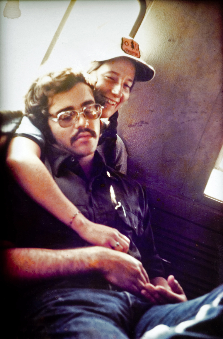 Two people sitting on a bus.