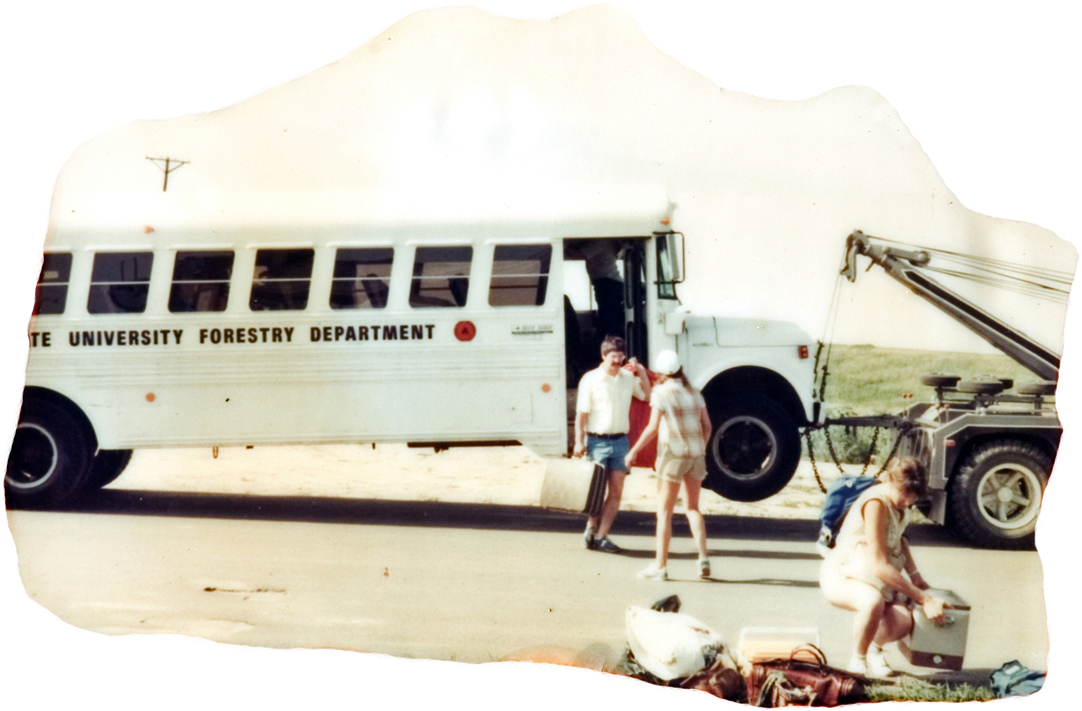People loading a school bus.