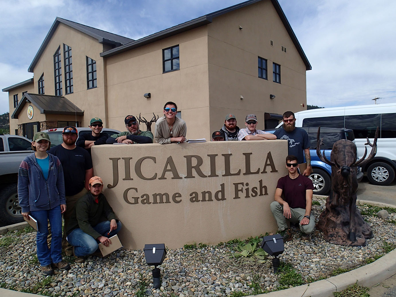 A group photo outside the Jicarilla Game and Fish building. 