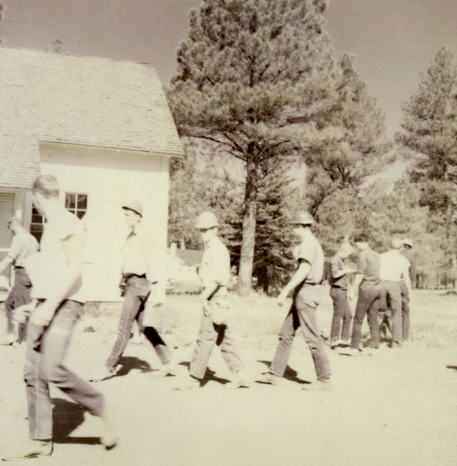 A group of people walking outside. A group of people walking outside.