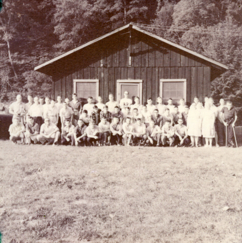 A large group of people outside smiling at the camera. A large group of people outside smiling at the camera.