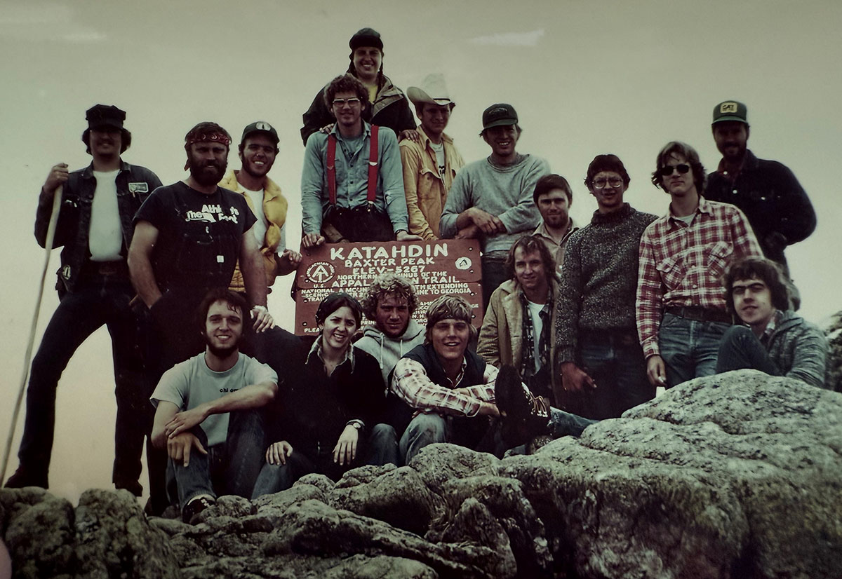 The OSU Undergraduate students from lake Nicatous camp gathering on a big rock around a sign with the header The OSU Undergraduate students from lake Nicatous camp gathering on a big rock around a sign with the header