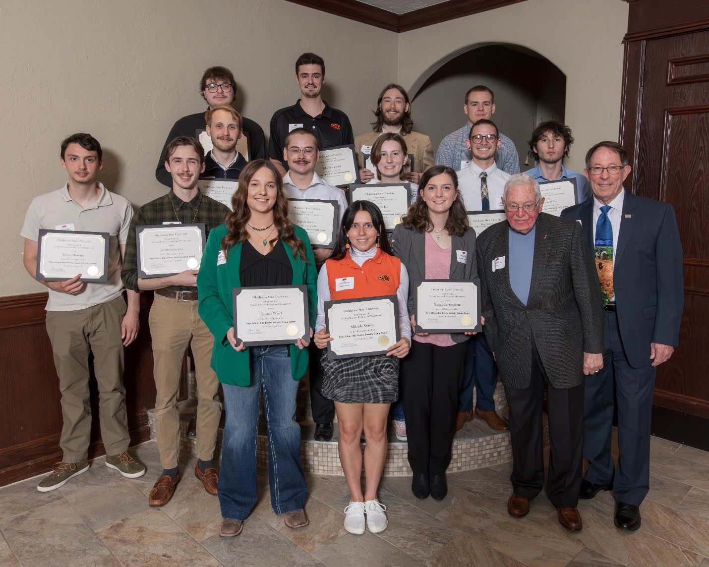 A group photo of people holding their award.
