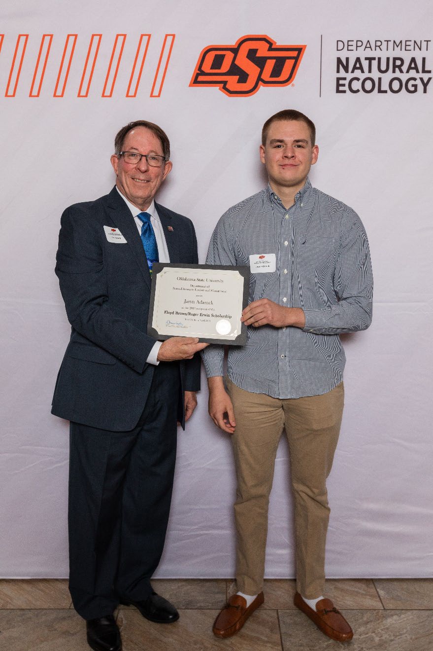 Jaryn accepting his award next to Dr. Jim Ansley.