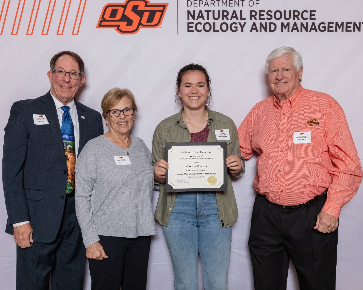 Vanessa holding her award next to Donors and Ron and Dr. Jim Ansley.