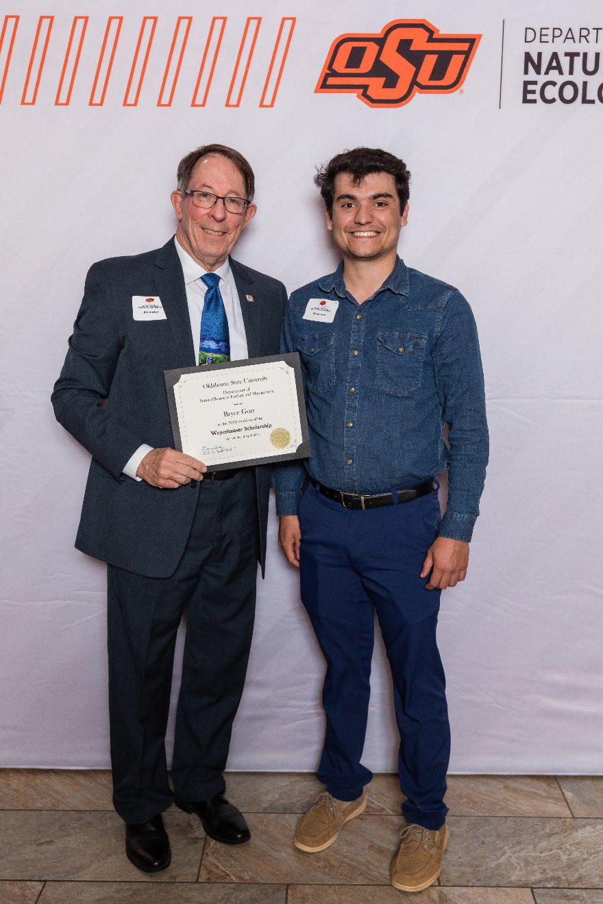 David is accepting his award with Dr. Jim Ansley.