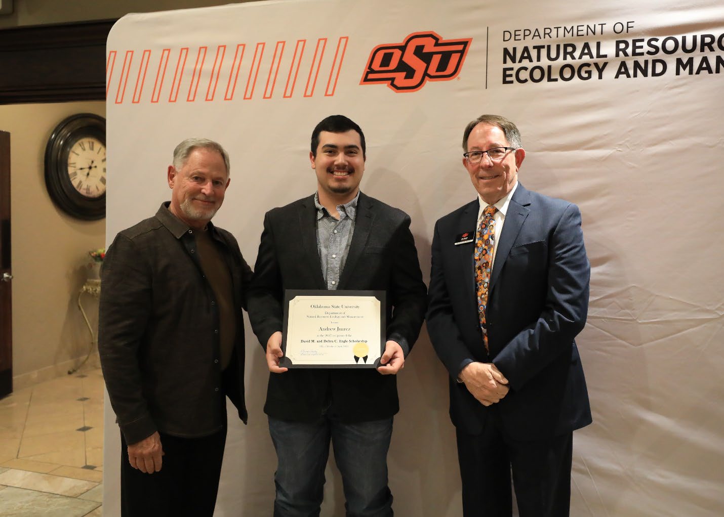Andrew Jaurez and his plaque next to Dr. Dave Engle and Dr. Jim Ansley.