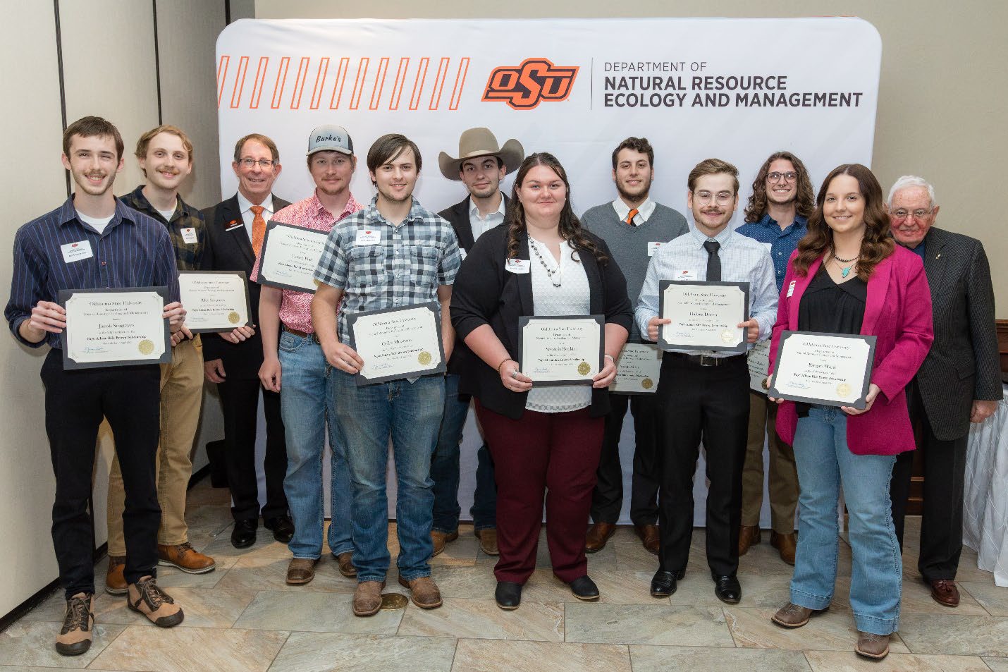 A group of ten people accepting their Undergraduate Student Scholarship award.