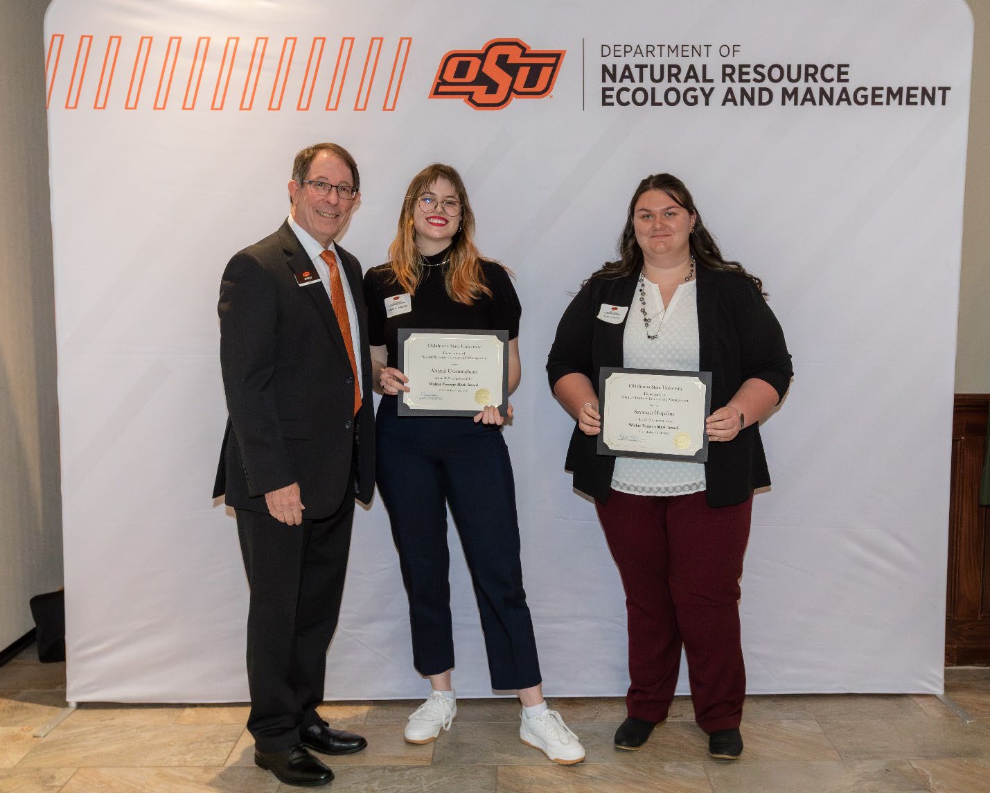 Abigail and Savanah with Jim Ansley accepting their Undergraduate Student Scholarship award.
