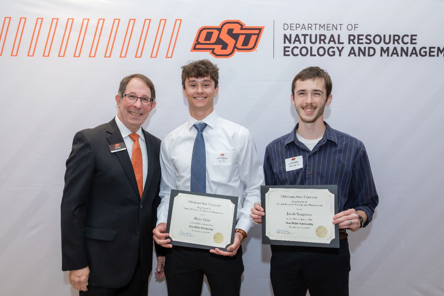 Bryce Gorr and Jacob Seagraves with Jim Ansley accepting their Undergraduate Student Scholarship award.