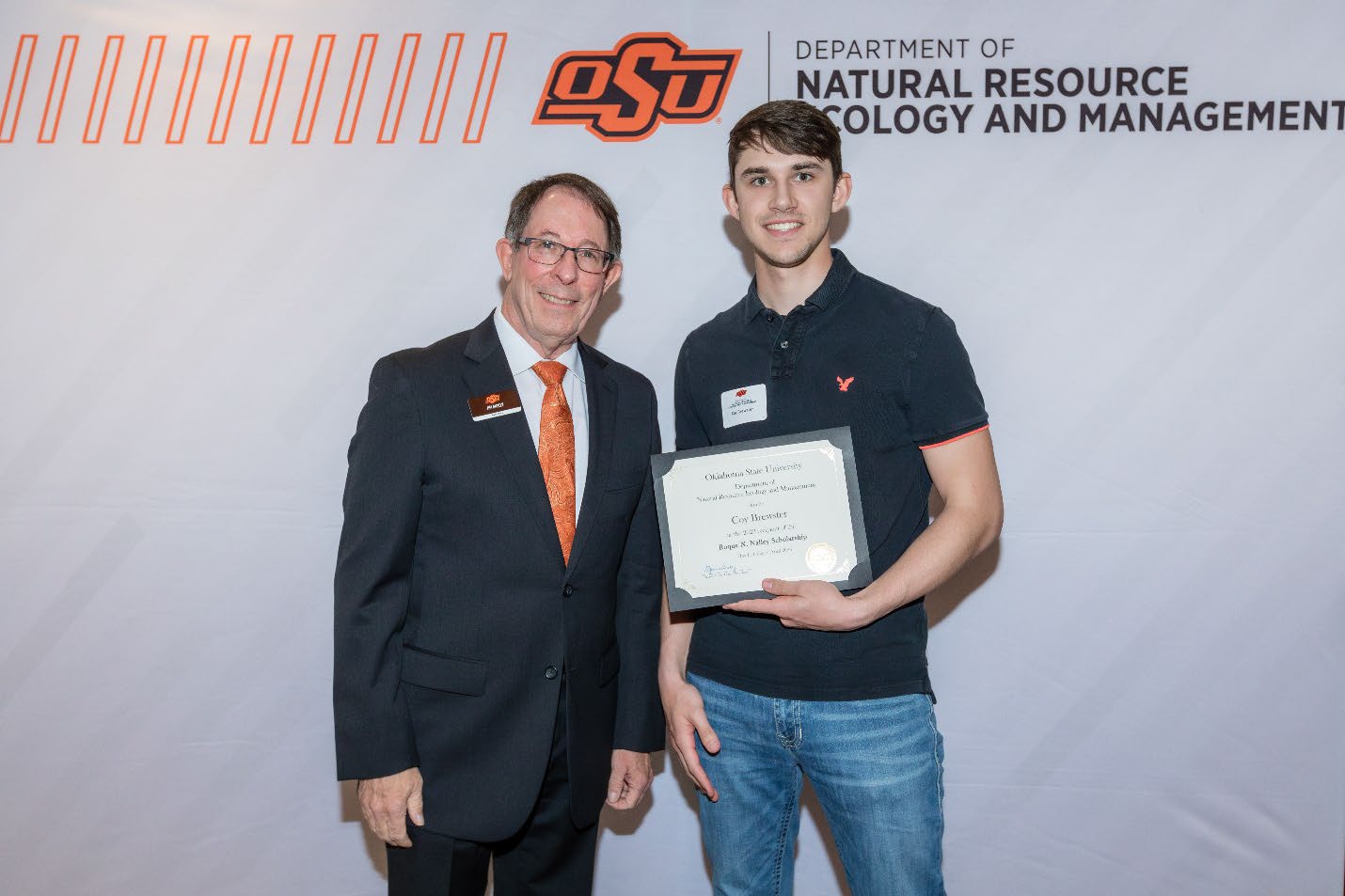 Coy Brewster with Jim Ansley accepting his Undergraduate Student Scholarship award.