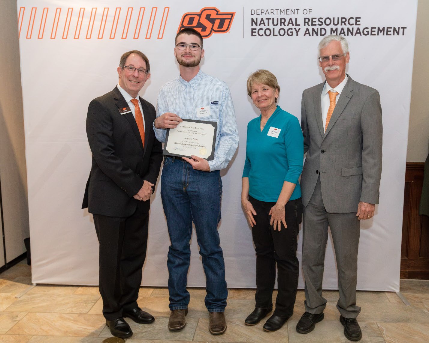Andrew Jolin and Donors Mia with Jim Ansley accepting their Undergraduate Student Scholarship award.