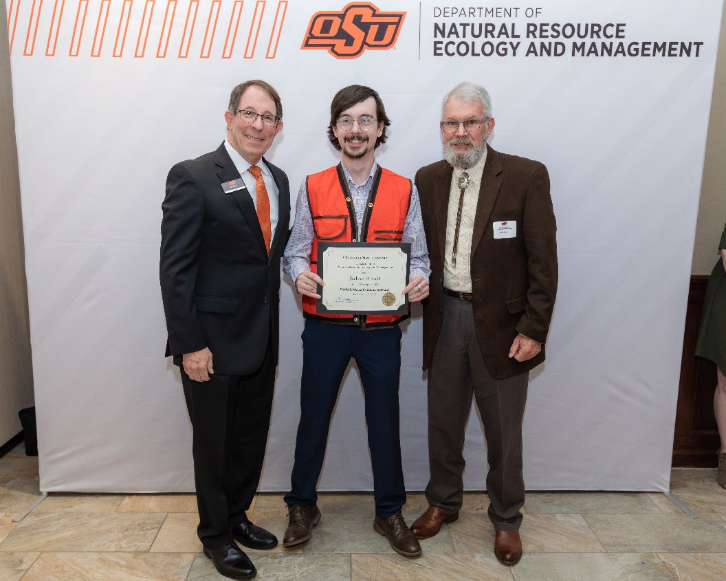 Jackson Russell with Jim Ansley accepting his Undergraduate Student Scholarship award.