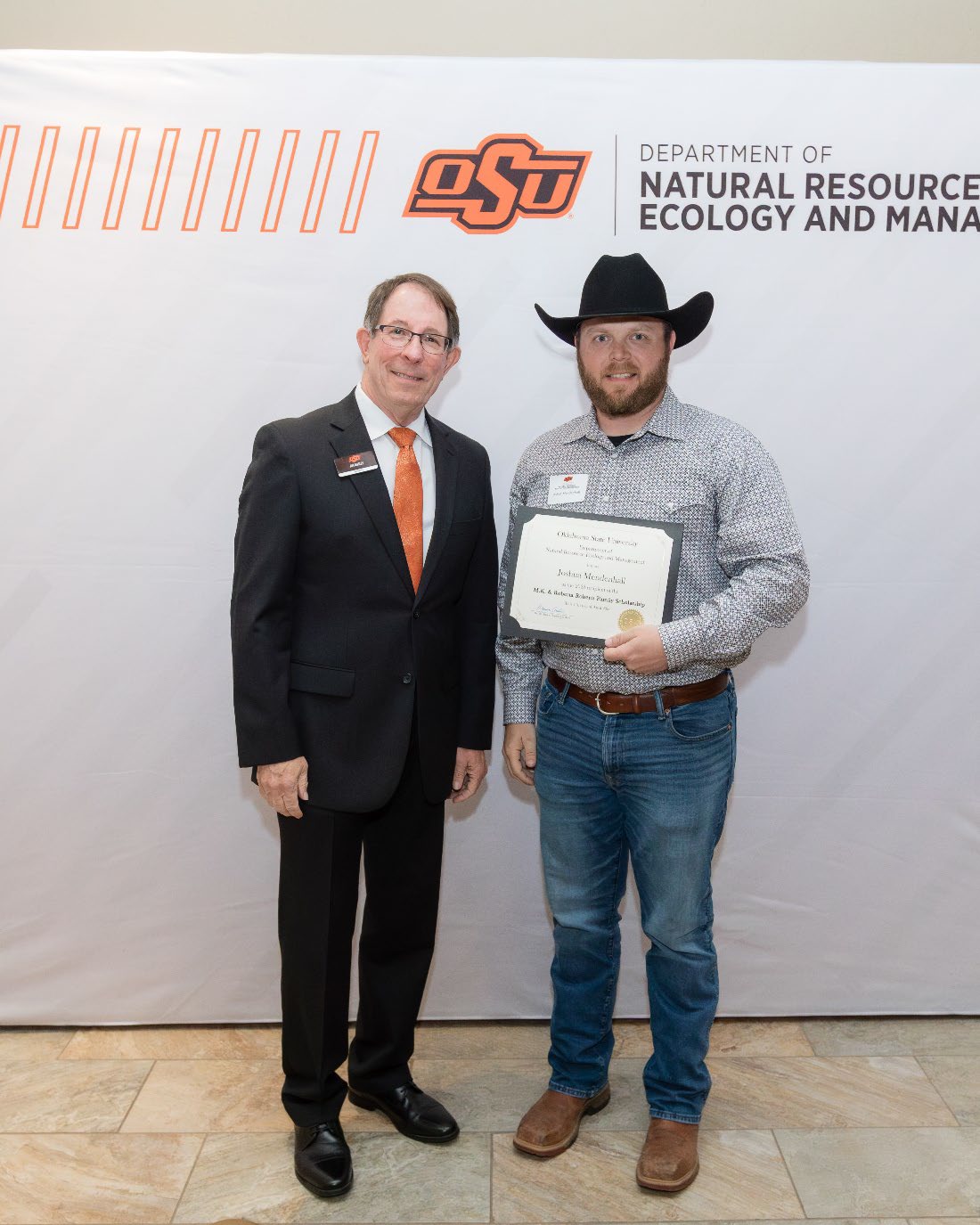 Joshua Mendenhall with Jim Ansley accepting his Undergraduate Student Scholarship award.