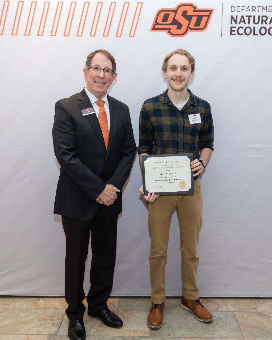 Riley Seagraves with Jim Ansley accepting his Undergraduate Student Scholarship award.