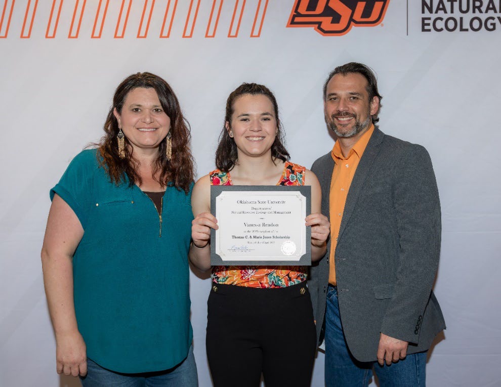 Vanessa Rendon and parents accepting their Undergraduate Student Scholarship award.