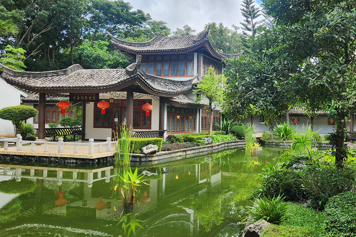 thailand-study-abroad-course-1200x800.jpg A traditional Thai building sits in a green garden area.