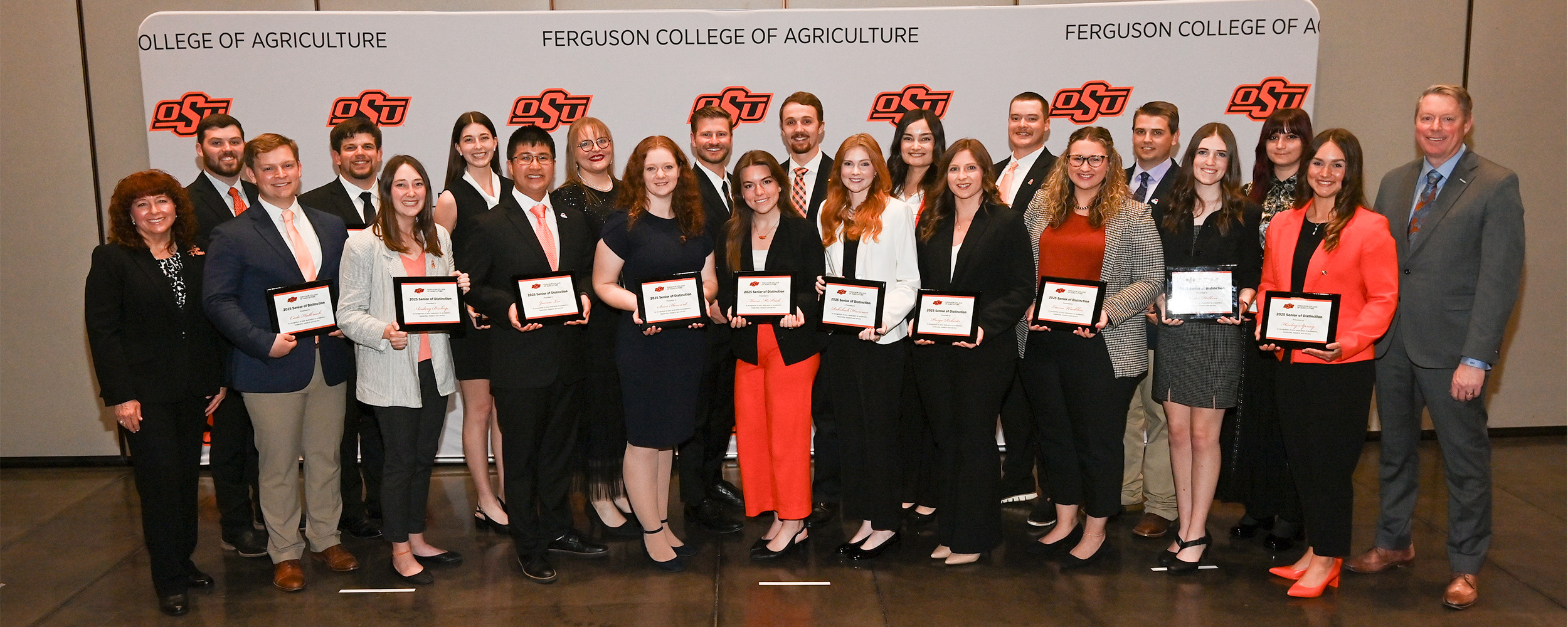 The Ferguson College Seniors of Distinction stand with Dr's Jayson Lusk and Cynda Clary.